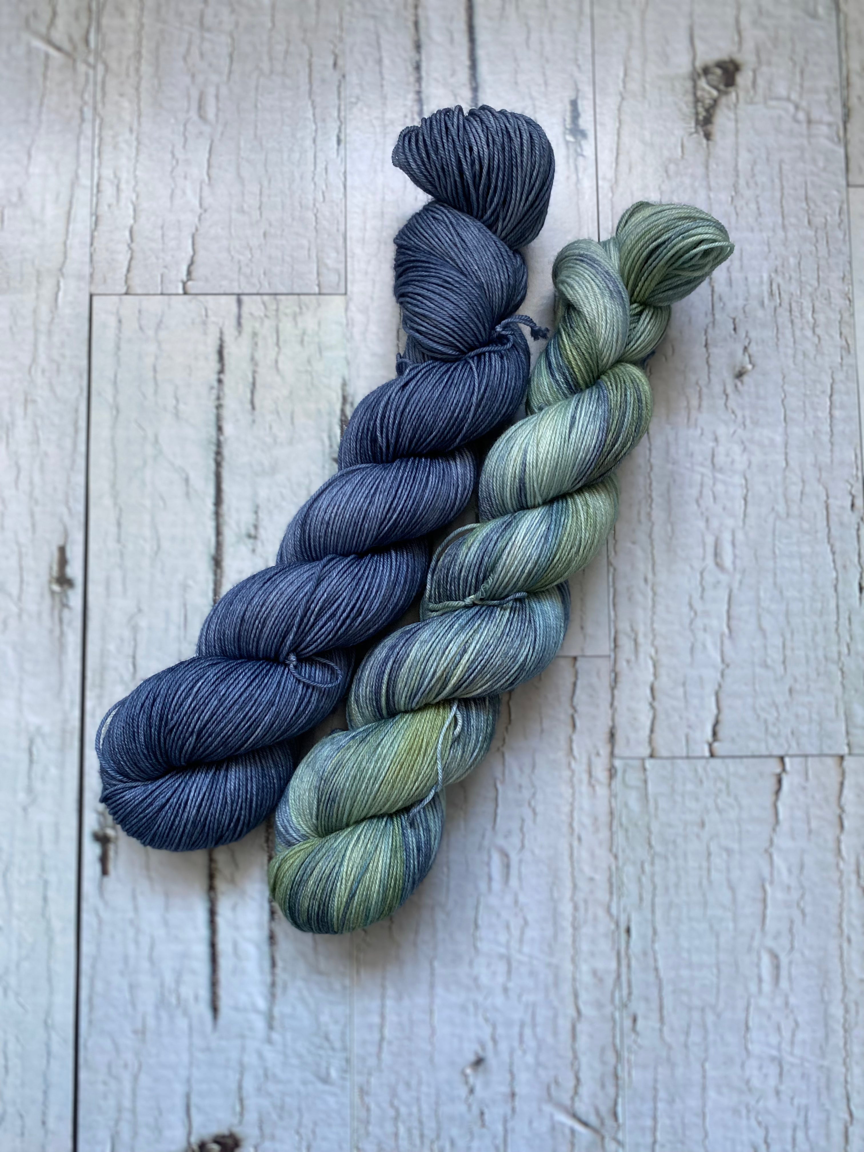 Two Skeins of Everyday Fingeringing, Man Cave on the left and Sea Beast on the Right.